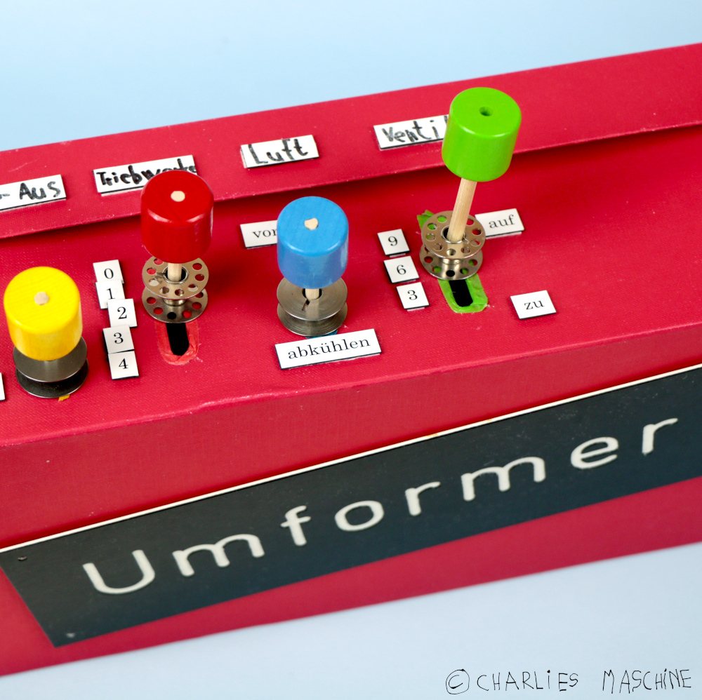 Umformer (transformer) – cardboard box, chopsticks and wooden beads; Charlie age 6